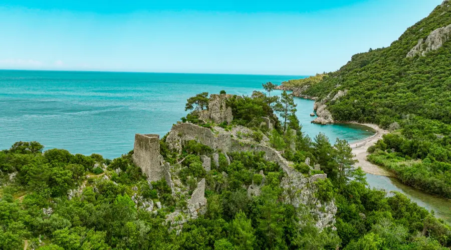 Aerial view of Olympos-Antalya, ancient city of olympos, olympos beach, people swimming on the beach, olympos castle, aerial view of the ancient city